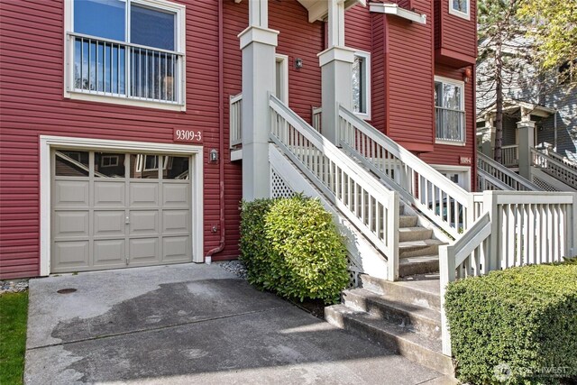 9309 177th Pl NE Unit 3, Redmond, WA 98052 - property entrance featuring an attached garage and driveway