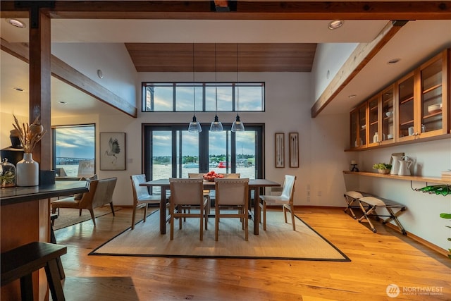 2235 Fairview Ave E Unit 12, Seattle, WA 98102 - dining area featuring healthy amount of natural light, light wood-style flooring, high vaulted ceiling, and beamed ceiling