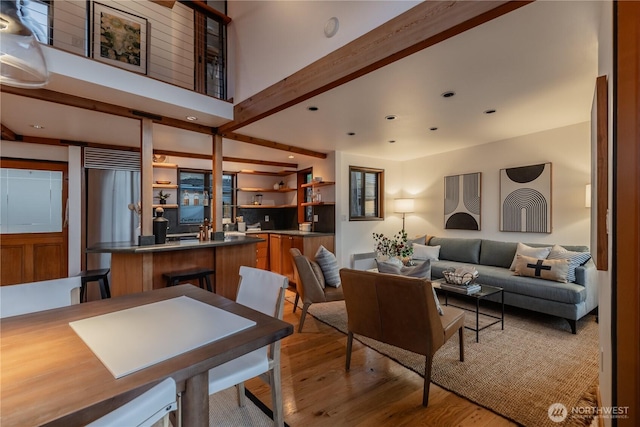 2235 Fairview Ave E Unit 12, Seattle, WA 98102 - living area with light wood-style flooring, wet bar, and recessed lighting