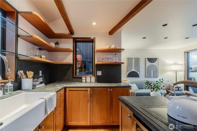 2235 Fairview Ave E Unit 12, Seattle, WA 98102 - kitchen with open shelves, brown cabinetry, open floor plan, beamed ceiling, and recessed lighting