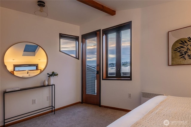 2235 Fairview Ave E Unit 12, Seattle, WA 98102 - carpeted bedroom featuring beam ceiling and baseboards