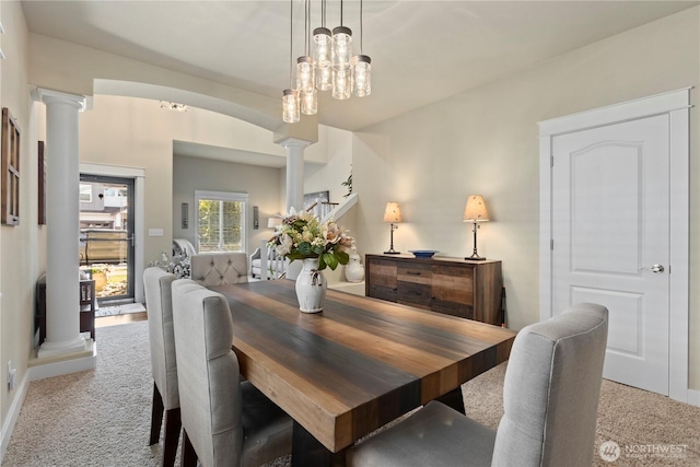 5603 116th St NE, Marysville, WA 98271 - dining room featuring carpet floors, baseboards, and decorative columns