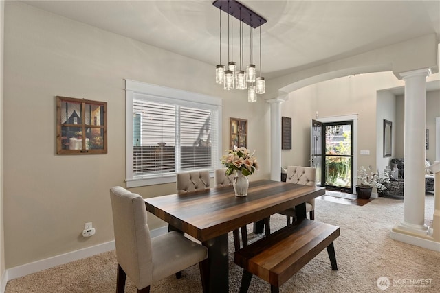 5603 116th St NE, Marysville, WA 98271 - carpeted dining room with ornate columns, arched walkways, and baseboards