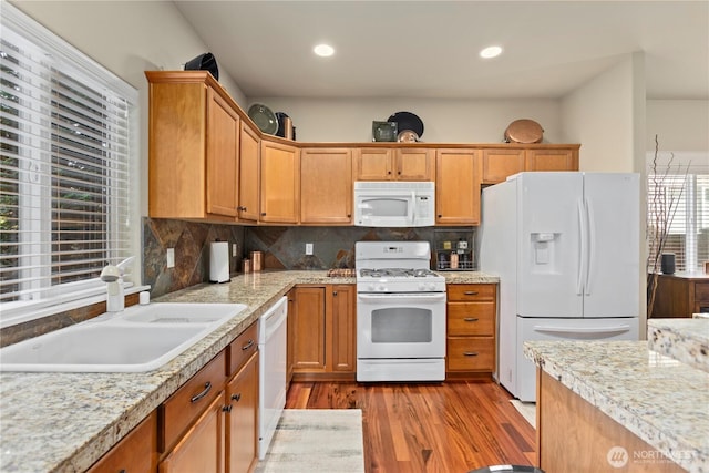 5603 116th St NE, Marysville, WA 98271 - kitchen with white appliances, light wood-style floors, a sink, and light countertops