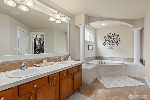 5603 116th St NE, Marysville, WA 98271 - full bath featuring ornate columns, a sink, double vanity, and visible vents