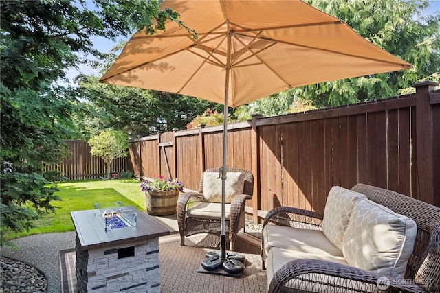 5603 116th St NE, Marysville, WA 98271 - view of patio featuring a fenced backyard and a fire pit