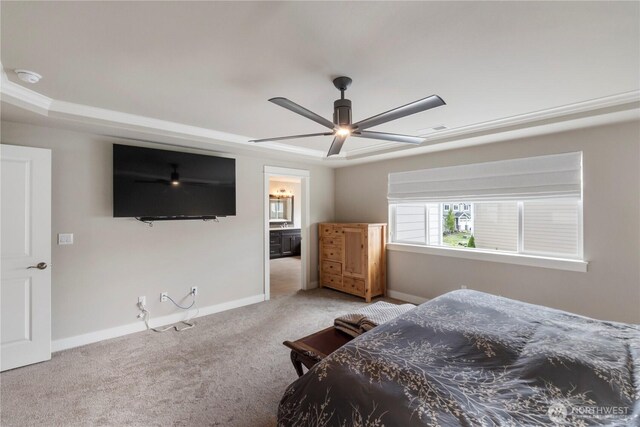 bedroom with carpet, baseboards, ceiling fan, and ensuite bath