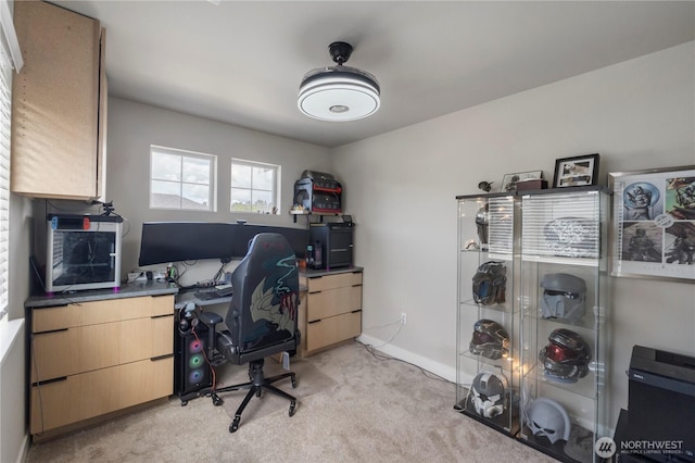 office featuring light colored carpet and baseboards
