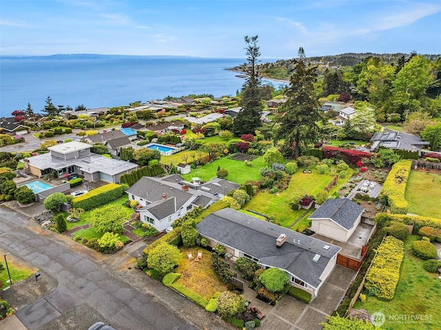 birds eye view of property with a residential view and a water view
