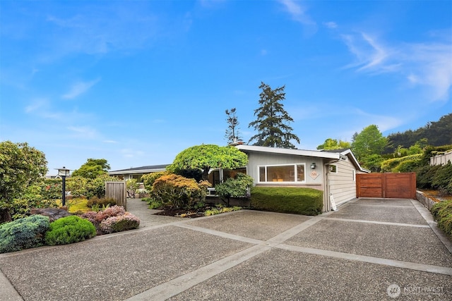 view of front of home featuring fence