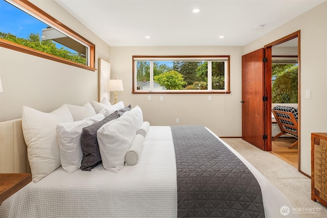 bedroom with carpet floors, recessed lighting, and access to exterior