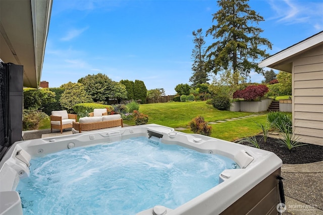 view of pool featuring a lawn and a hot tub