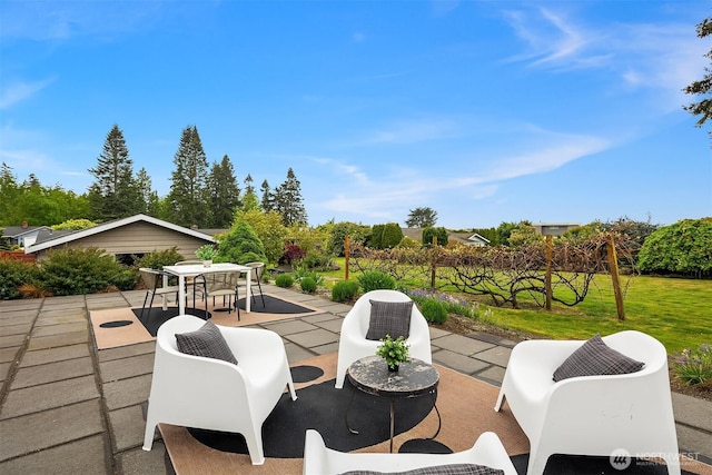 view of patio featuring outdoor dining area