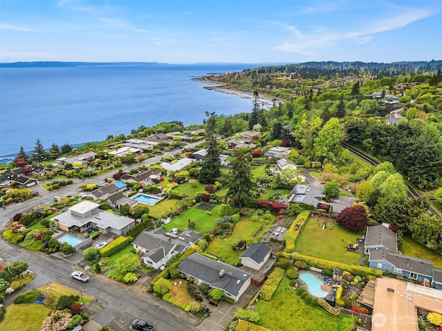 birds eye view of property with a residential view and a water view
