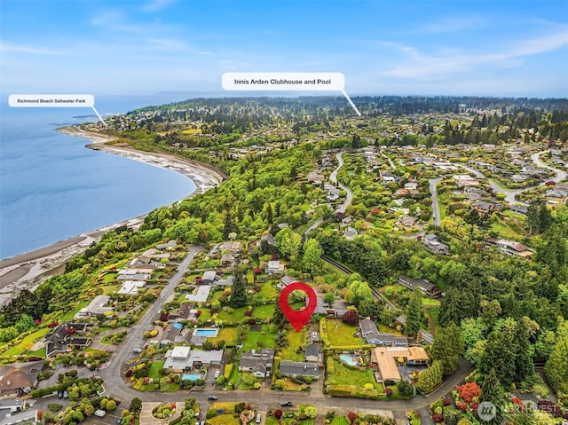 birds eye view of property with a water view and a residential view