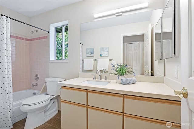 full bathroom featuring tile patterned floors, shower / bathtub combination with curtain, vanity, and toilet