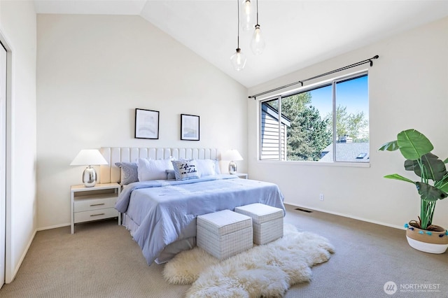 bedroom with baseboards, light carpet, vaulted ceiling, and visible vents