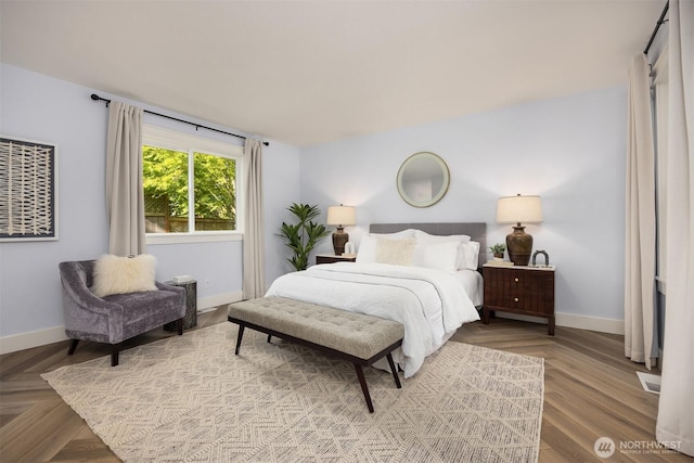 bedroom featuring baseboards