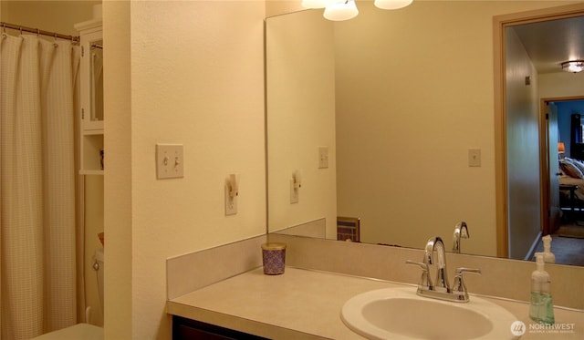 full bath with curtained shower and vanity
