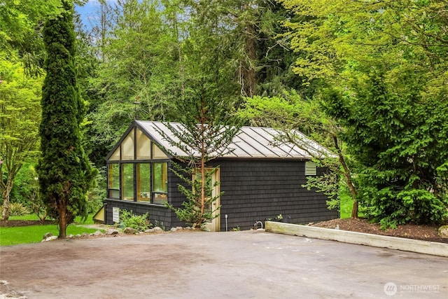 exterior space with metal roof and a standing seam roof