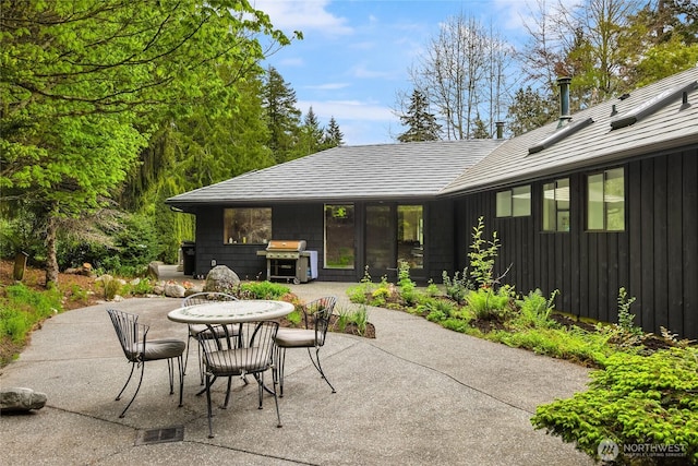 view of patio / terrace featuring grilling area, outdoor dining space, and visible vents