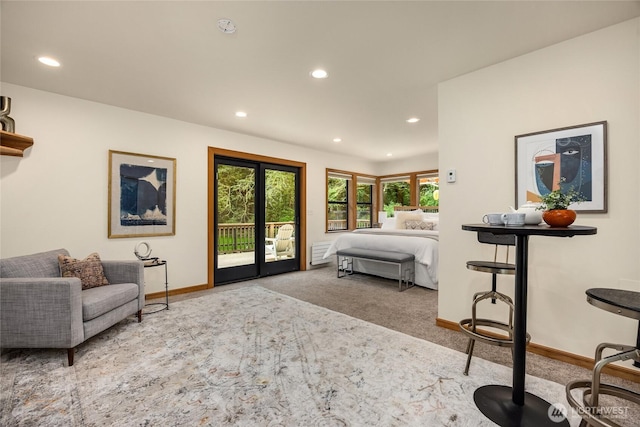 bedroom with baseboards, recessed lighting, and access to exterior