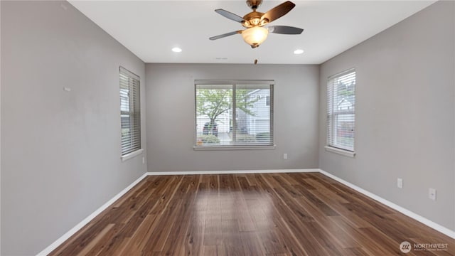 spare room featuring baseboards, a ceiling fan, wood finished floors, and recessed lighting