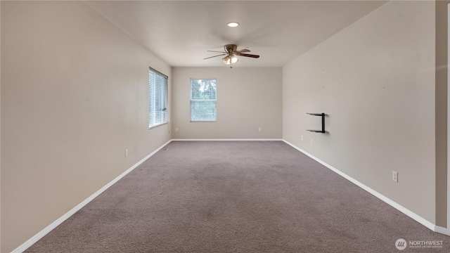 unfurnished room with baseboards, ceiling fan, and carpet flooring