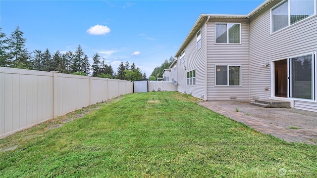 view of yard with a fenced backyard