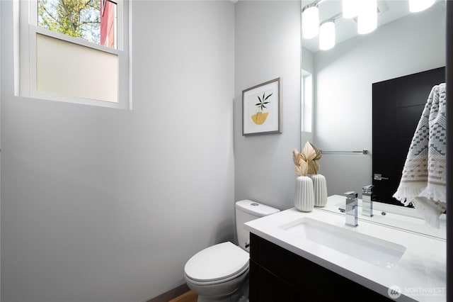 bathroom with vanity and toilet