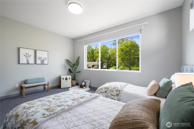 carpeted bedroom with baseboards