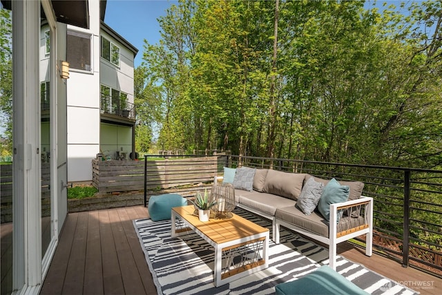wooden terrace with outdoor lounge area
