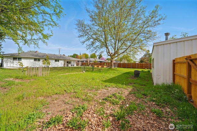 view of yard with a fenced backyard