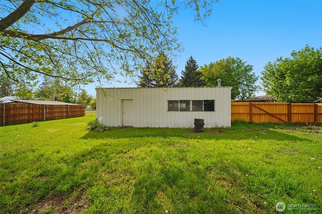 view of outdoor structure with a fenced backyard and an outdoor structure