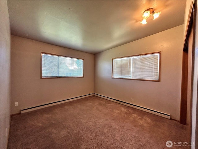 empty room with vaulted ceiling, carpet flooring, and a baseboard heating unit