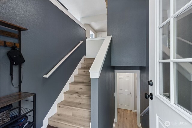 stairs with wood finished floors