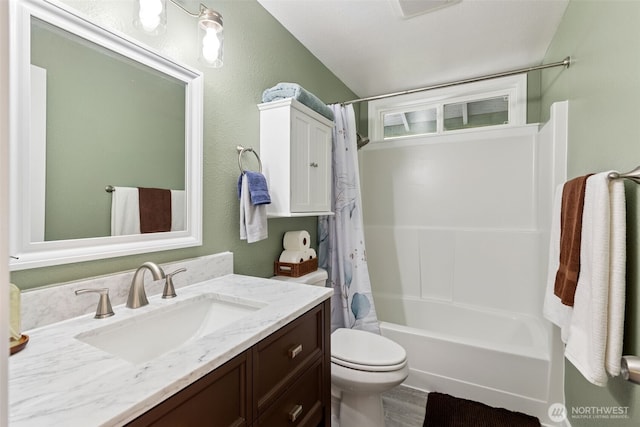 bathroom featuring toilet, vanity, shower / tub combo with curtain, and lofted ceiling
