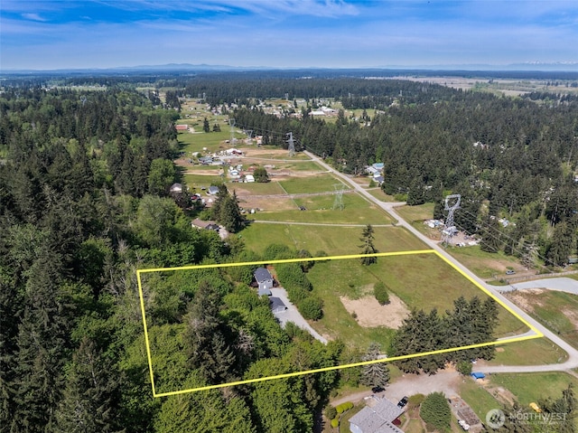 aerial overview of property's location featuring a forest and property boundaries highlighted