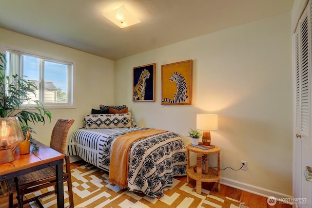 4802 S Austin St, Seattle, WA 98118 - bedroom featuring wood finished floors and baseboards