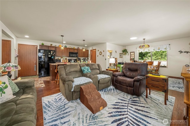living area featuring recessed lighting and wood finished floors