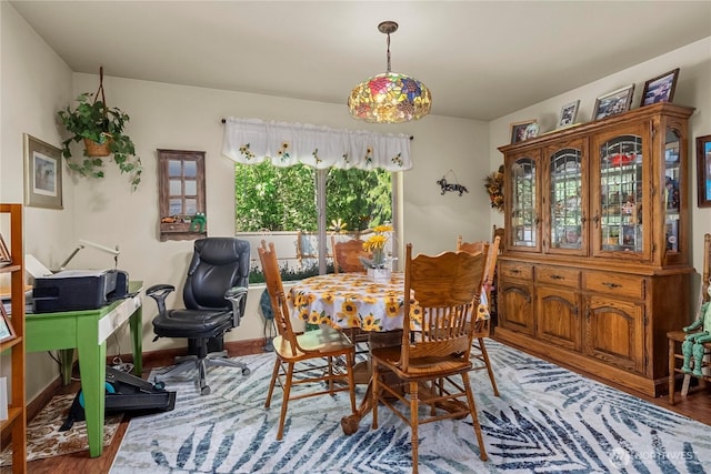 dining area with wood finished floors