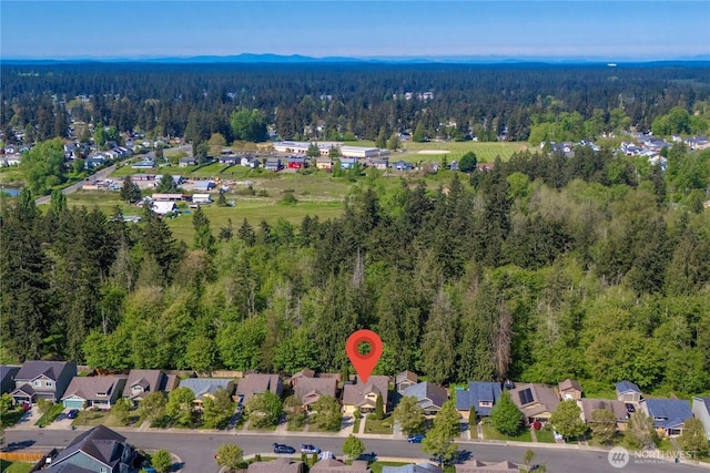 bird's eye view with a residential view and a wooded view