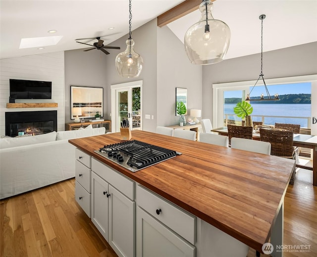 13967 SW 248th St, Vashon, WA 98070 - kitchen featuring a ceiling fan, butcher block counters, open floor plan, and stainless steel gas cooktop