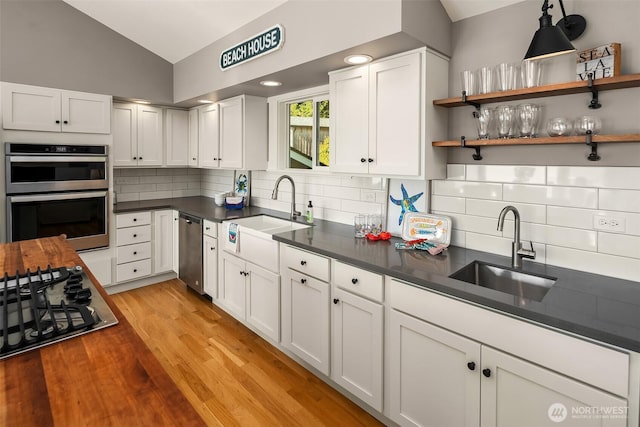 13967 SW 248th St, Vashon, WA 98070 - kitchen featuring a sink, lofted ceiling, tasteful backsplash, and stainless steel appliances