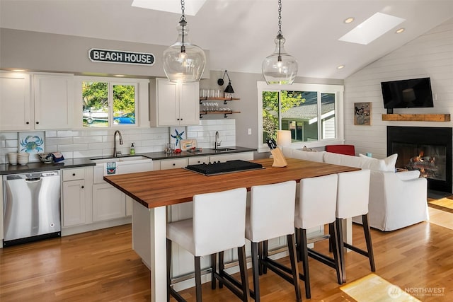 13967 SW 248th St, Vashon, WA 98070 - kitchen with a sink, appliances with stainless steel finishes, butcher block countertops, and open floor plan
