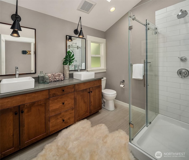 13967 SW 248th St, Vashon, WA 98070 - bathroom featuring a sink, a stall shower, double vanity, and visible vents