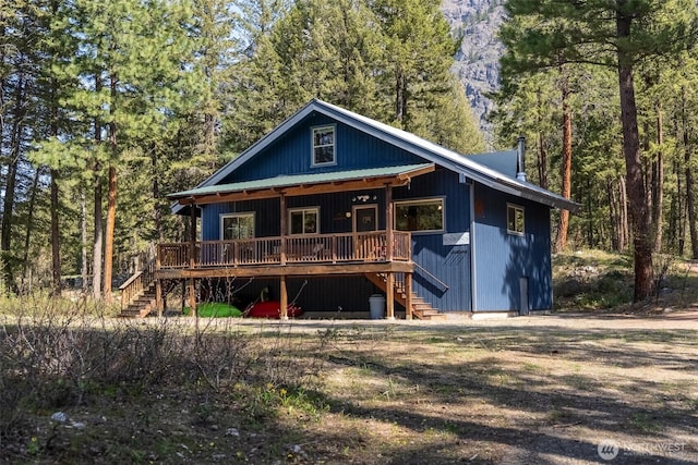 225C Lost River Rd, Mazama, WA 98833 - rear view of property with stairway, a wooded view, and covered porch