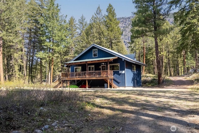 225C Lost River Rd, Mazama, WA 98833 - view of front of home with a view of trees, stairs, and a porch