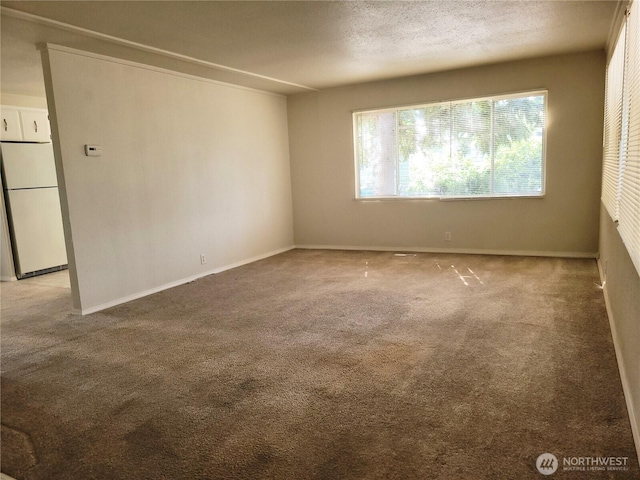 5220 176th St SW Unit 12, Lynnwood, WA 98037 - carpeted spare room featuring baseboards