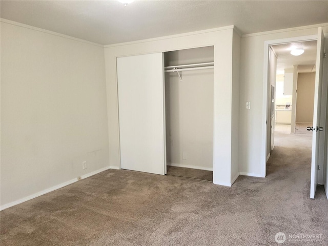 5220 176th St SW Unit 12, Lynnwood, WA 98037 - unfurnished bedroom with baseboards, carpet flooring, a closet, and crown molding